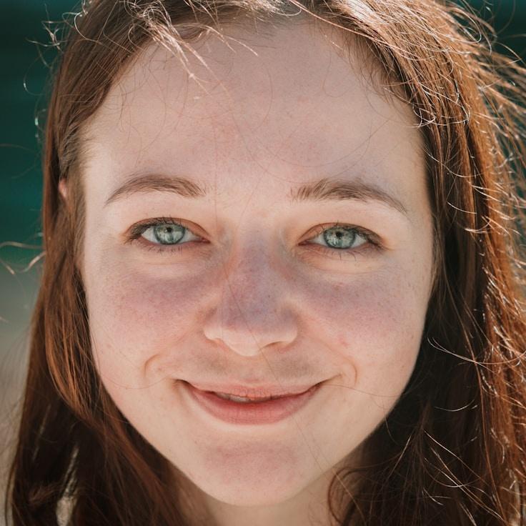 Kaveri Mehta, Lead Design Curator at MeadowHarvestLab, reviewing corporate floral arrangements